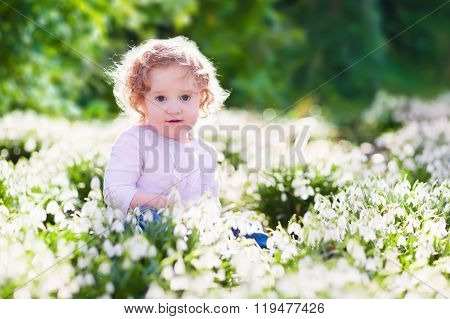 Little Girl In Sunny Flower Field
