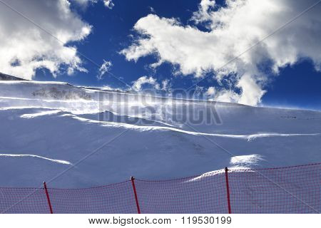 Off-piste Slope During A Blizzard And Sunlight Blue Sky