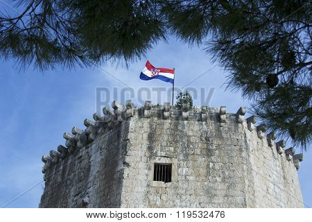 UNESCO protected fortress with Croatian flag on top, Trogir.
