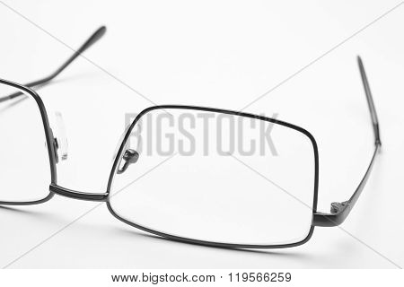 Male Eyeglasses Macro Detail Over A White Background.
