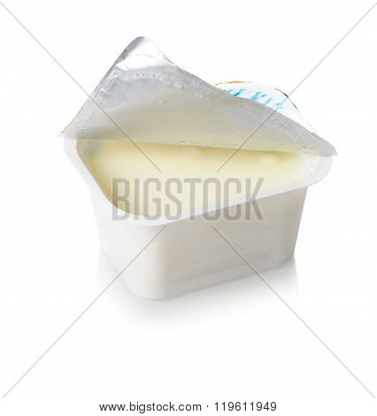 natural yogurt in white plastic container over white background