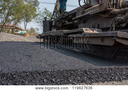 In flexible pavements the upper layer consists of asphalt concrete that is a construction aggregate with a bituminous binder. The wearing course is typically placed on the base course