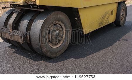 In flexible pavements the upper layer consists of asphalt concrete that is a construction aggregate with a bituminous binder. The wearing course is typically placed on the base course