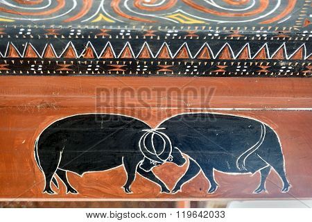 Toraja Traditional House Wood Carvings And Paitings With Fight Of Black Buffaloes