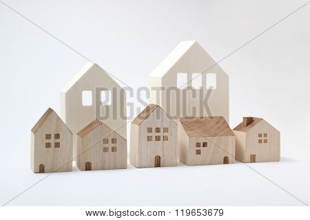 Miniature houses on white background.