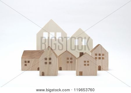Miniature houses on white background.