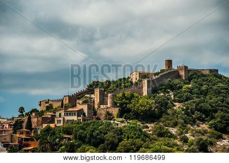 Capdepera castle on green hill in Mallorca