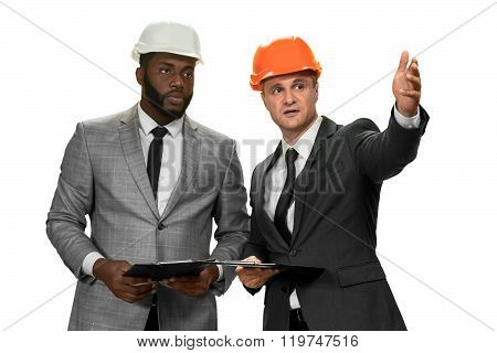 Darkskinned construction manager.