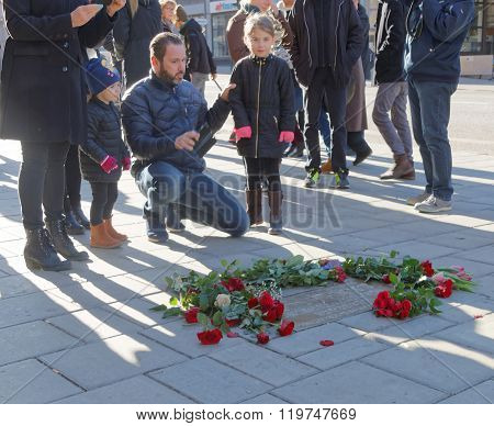 Father And Children Showing Respect To The Murdered Prime Minister Olof Palme
