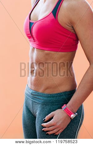 taut muscular young girl in sportswear