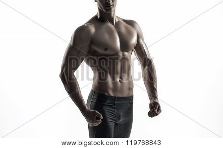 Bodybuilder man posing, showing perfect abs, houlders, biceps, triceps, chest