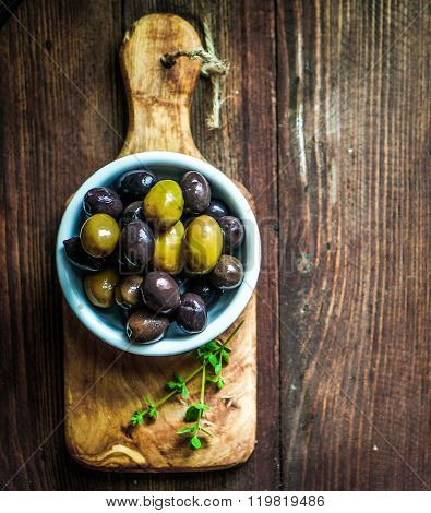 Olives On Rustic Wooden Background