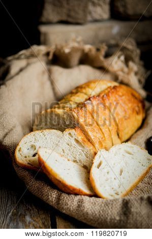 Sliced Fresh Bread On Wooden Background