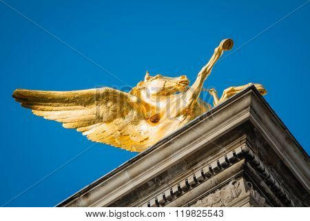 Golden Pegauses Statue From Low Angle