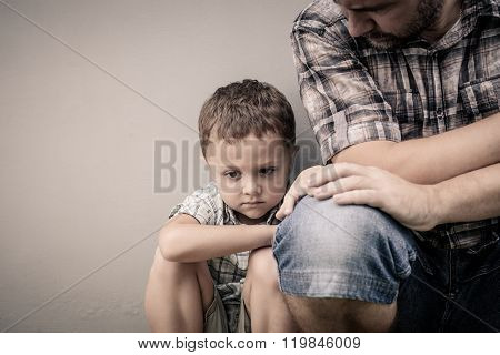 Sad Son Hugging His Dad
