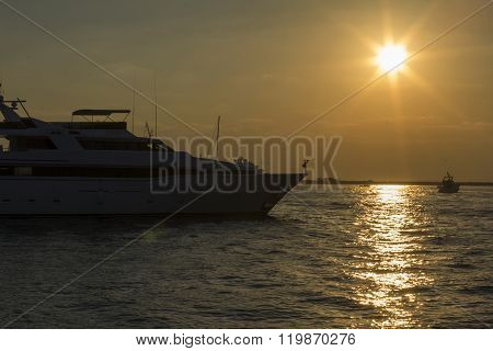 seascape view of a large motor yacht at sunset in  Dubai