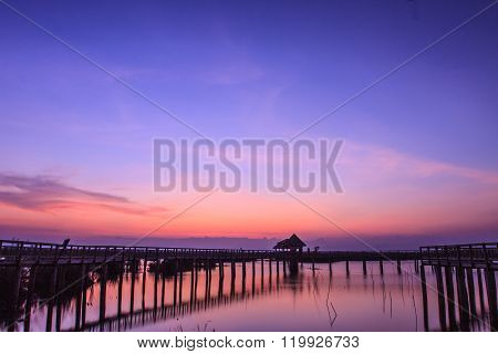 Wooden Bridge In Lotus Lake On Sunset Time