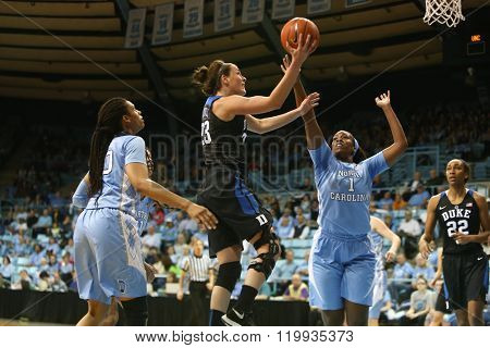CHAPEL HILL, NC-FEB 28: Duke Blue Devils guard Rebecca Greenwell (23) drives to the basket as UNC Tar Heels forward Rachel McGirt (1) defends on February 28, 2016 at Carmichael Arena.
