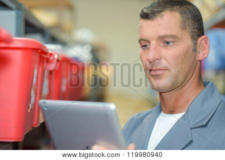 man looking at the tablet