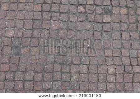 Broadly rectangular quarried stone used for paving roads