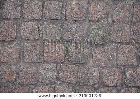 Dry dusty rectangular granite setts from above