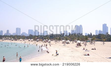 DUBAI, UNITED ARAB EMIRATES - APRIL 1st, 2014: Panoramic view on nice Al Mamzar beach, famous tourist destination with clear blue water of Persian gulf.