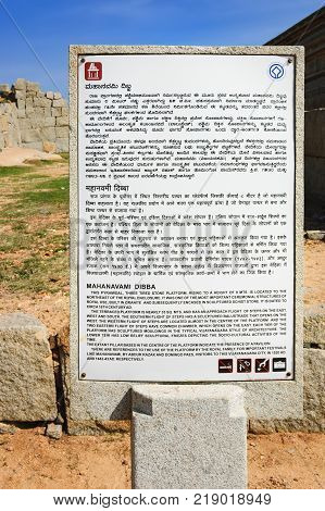 Hampi, India - November 20, 2012: Signpost for tourists about platform of Mahanavami Dibba in Hampi, Karnataka, India.