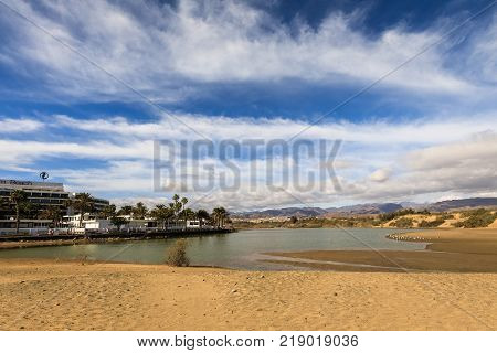 La Charca, bird observation place and nature reserve in Maspalomas in Gran Canaria, Spain. Great place for bird observations. Palm Beach hotel on the left.