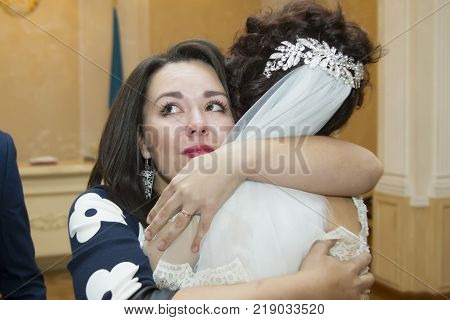 Belarus Gomel 7 October 2017. Wedding day.A woman is crying while congratulating the bride. Congratulate the bride.