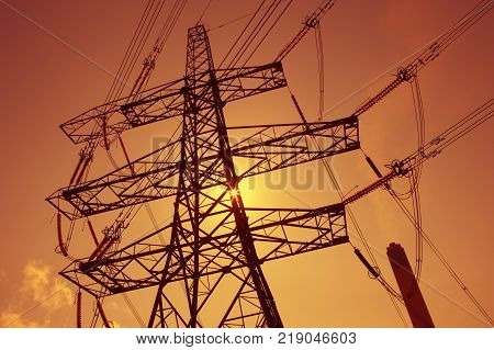 Electricity Pylons In Silhouette At Sunest Drax Power Station Yorkshire England