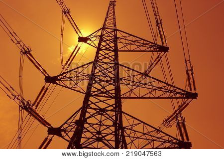 Electricity Pylons In Silhouette At Sunest Drax Power Station Yorkshire England