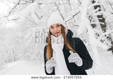 Beautiful Young Girl In A White Winter Forest