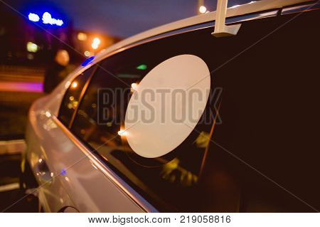New Year 2018 is coming concept - inscription 2017 and 2019 written in frost on a car windscreen, with an ice scraper beginning to remove the digits 2017