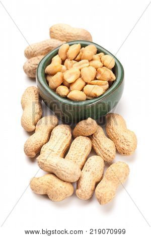 Roasted peanuts with peanut shells isolated on white background