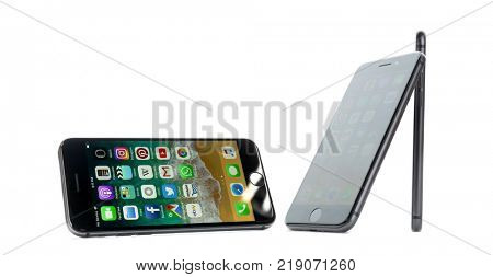 KIEV, UKRAINE - NOVEMBER 28, 2017: Front and side views of Space Gray iPhone 8 with home screen on white background