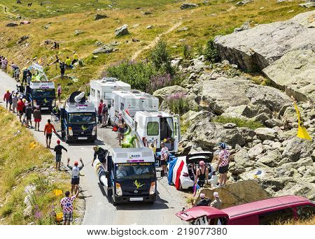 Col de la Croix de Fer France - 25 July 2015: Bostik caravan driving on the road to the Col de la Croix de Fer in Alps during the stage 20 of Le Tour de France 2015.
