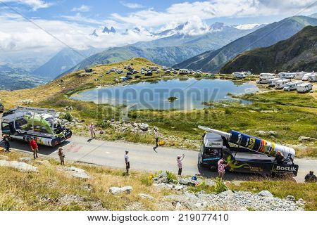 Col de la Croix de Fer France - 25 July 2015: Bostik caravan driving on the road to the Col de la Croix de Fer in Alps during the stage 20 of Le Tour de France 2015.