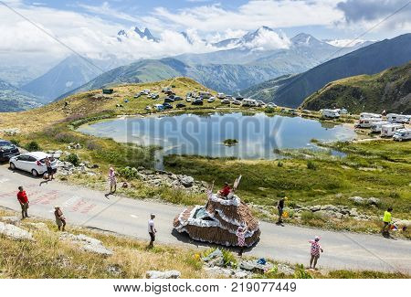 Col de la Croix de Fer France - 25 July 2015: Banette caravan driving on the road to the Col de la Croix de Fer in Alps during the stage 20 of Le Tour de France 2015. Banette is the leading brand for the artisan bread in France.
