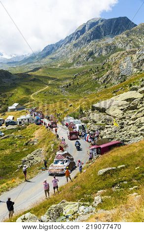 Col de la Croix de Fer France - 25 July 2015: Banette caravan driving on the road to the Col de la Croix de Fer in Alps during the stage 20 of Le Tour de France 2015. Banette is the leading brand for the artisan bread in France.