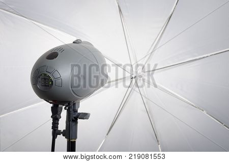 Professional photography studio flash light with reflecting umbrella