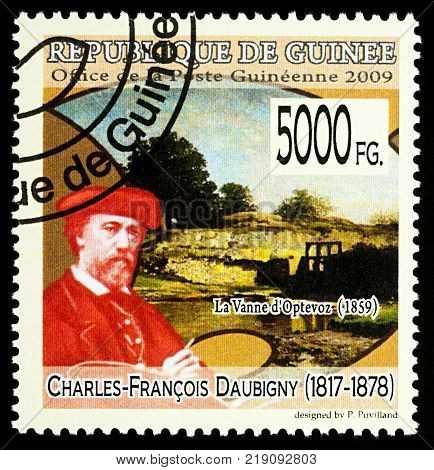 Moscow Russia - December 19 2017: A stamp printed in Guinea shows French artist Charles-Francois Daubigny (1817-1878) and his picture 