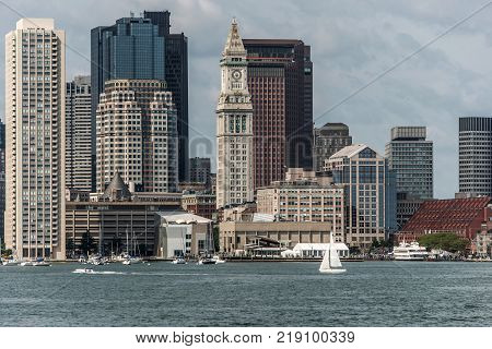 Sailing boats on the Charles River in front of the Boston Skyline in Massachusetts USA on a sunny summer day