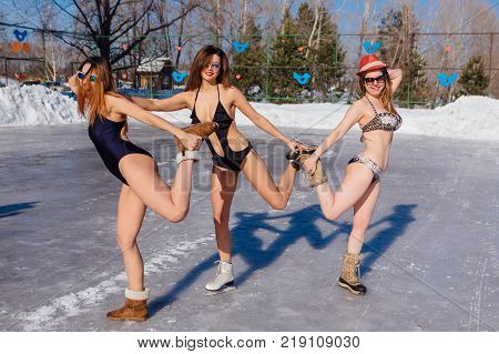 Novokuznetsk, Kemerovo region, Russia - 23 Feb, 2017 : White beaches of Siberia is an enterteiment activity where people playing beach games dressed in bikini in winter. Women in bikini on ice skates