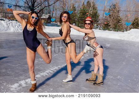 Novokuznetsk, Kemerovo region, Russia - 23 Feb, 2017 : White beaches of Siberia is an enterteiment activity where people playing beach games dressed in bikini in winter. Women in bikini on ice skates