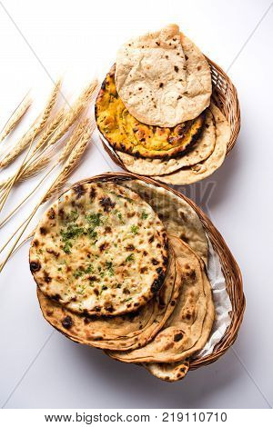 Assorted Indian Bread Basket includes chapati, tandoori roti or naan, paratha, kulcha, fulka, missi roti