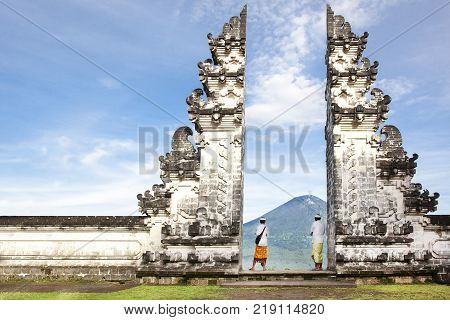 balinese people standing betwen Lempuyang gate. Bali