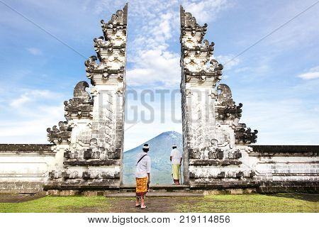 balinese people standing betwen Lempuyang gate. Bali