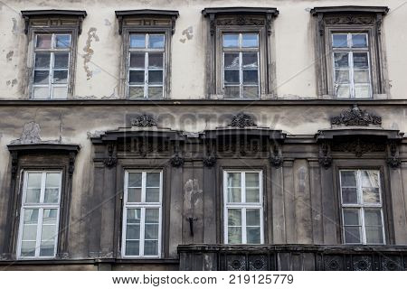 Facade of the old vintage gray house
