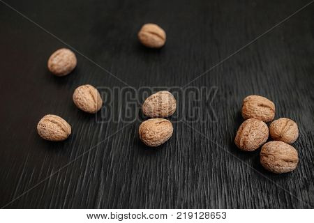 Lots Of Fresh Nuts On A Black Wooden Background. Best Practices For Designer