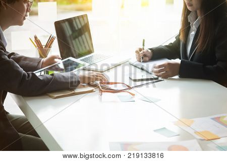 Business consulting conceptPeople meeting and planning adviser analyzing financial figures denoting the progress in the work.